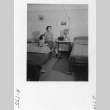 Hiroko Nishi and her daughter Eime sitting in their barracks bedroom (ddr-fom-1-879)