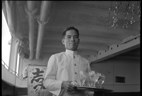 Ship steward with tray of glasses (ddr-densho-426-251)