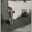 Boy with fishing pole and holding a fish (ddr-densho-523-260)