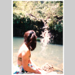 Young woman looking at waterfall (ddr-densho-368-311)