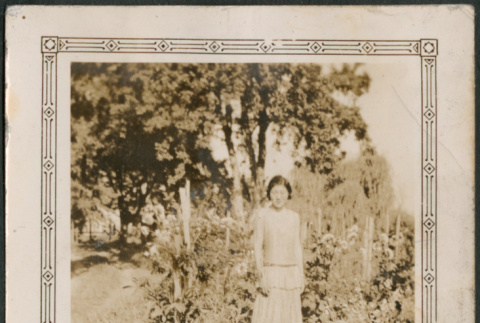 Woman standing in field (ddr-densho-316-182)