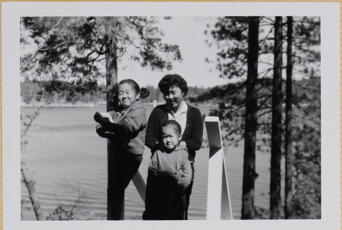 Woman and two girls on steps to lake (ddr-densho-522-405)