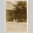 Three women by large building (ddr-densho-426-1536)
