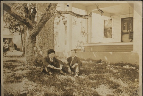 Two Issei men sitting near Oak trees (ddr-densho-259-38)