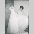 Bride holding wedding dress (ddr-densho-523-346)