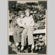 Two women sitting on ledge outside (ddr-densho-383-196)