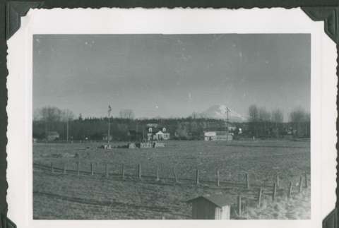 View of a farm with Mt. Rainier in the distance (ddr-densho-328-367)