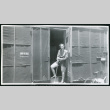 Photograph of Jone Ingalls standing in a barracks doorway (ddr-csujad-47-175)