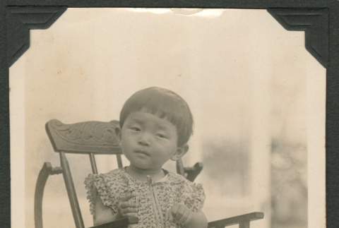 Hedeko in a high chair (ddr-densho-433-810)