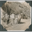 Four men standing by sign, Queen Lily Campground (ddr-ajah-2-360)