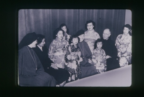 (Slide) - Image of girls in Kimono, nuns and priest seated (ddr-densho-330-32-master-d473bf9942)