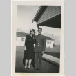 Woman standing next to a serviceman (ddr-manz-7-94)