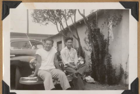 Two men on a bumper (ddr-densho-542-154)