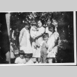 [Mrs. Taniguchi and family in orchard] (ddr-csujad-56-280)
