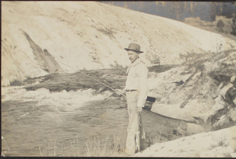 Man fishing at Yellowstone Park (ddr-densho-355-654)