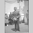 Man standing on deck of ship (ddr-densho-426-1980)