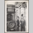Two men in uniform standing outside bar (ddr-densho-466-24)