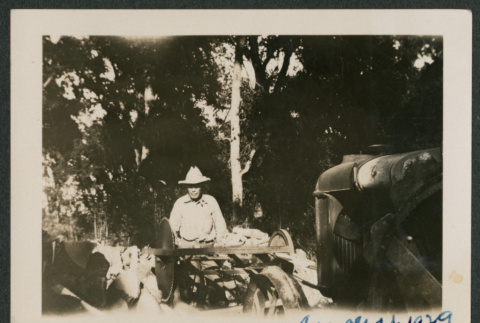 man and wood saw attached to tractor (ddr-densho-378-470)