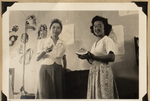 Alice and Mits Kikawa eating watermelon (ddr-densho-542-550)