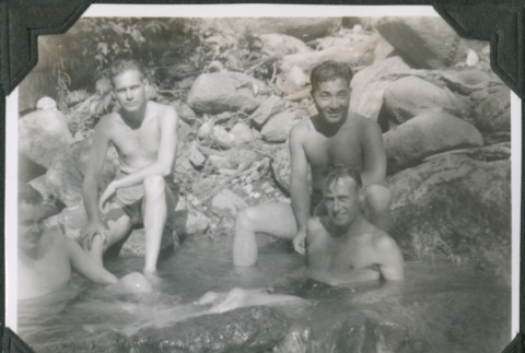 Four men sitting in river (ddr-ajah-2-636)