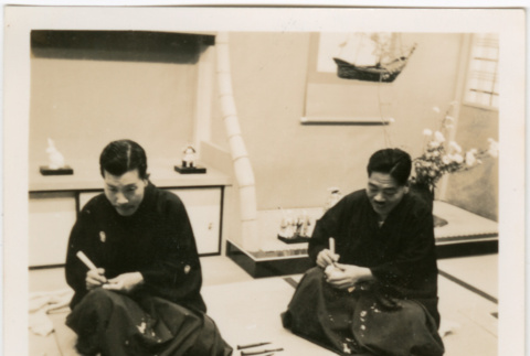Two men demonstrating carving (ddr-densho-426-2072)