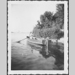 Man in uniform rowing a boat (ddr-densho-434-409)