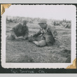 Two men sitting on ground (ddr-densho-434-73)
