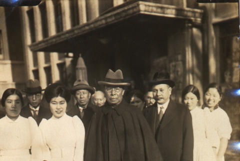 Matajiro Koizumi and other men posing with nurses (ddr-njpa-4-473)