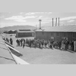 Japanese Americans lining up for mess hall (ddr-densho-93-21)