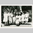 Domoto Family photograph in front of steps (ddr-densho-329-1106)