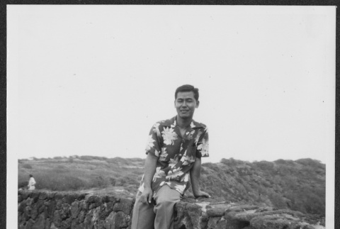 Nise man poses at lookout (ddr-densho-363-293)