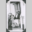 Photo of two women and a child on a front stoop (ddr-densho-483-1355)