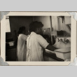 Two women washing in sink (ddr-densho-587-42)