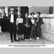 Family standing on sidewalk (ddr-ajah-6-328)