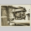 Cars pulling up to a building entry way (ddr-njpa-13-1240)