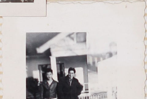 Two men standing outside house (ddr-densho-464-134)
