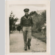Man in uniform walking on path (ddr-densho-426-1415)