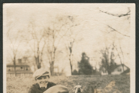 Photo of Roy Udoh with a man and dogs (ddr-densho-483-275)