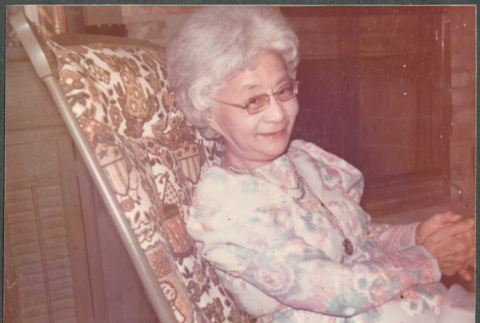 Agnes Sakura in chair (ddr-densho-523-640)