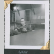 Man sitting at desk reading (ddr-densho-434-232)