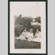 two girls and boy sitting on grass (ddr-densho-378-784)