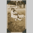 Two women sitting in grass (ddr-densho-383-176)