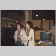 Man and woman standing by boxes (ddr-densho-426-379)