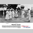 Group of women in aprons and bonnets beating on pots and pans (ddr-ajah-3-346)