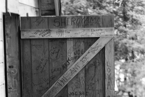 Camper graffiti on a cabin door (ddr-densho-336-504)