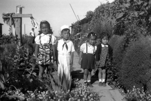 Four children in a garden (ddr-densho-34-109)