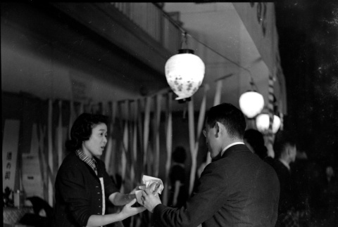 Woman serving man a sandwich (ddr-densho-426-1690)