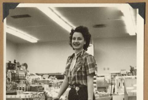 Woman standing by a counter (ddr-densho-542-121)