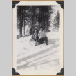 Two people kneeling in the snow (ddr-densho-542-328)