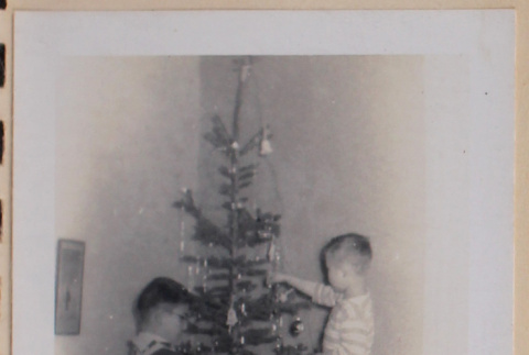 David, Peter, and Mary Alice  decorating Christmas tree (ddr-densho-462-274)